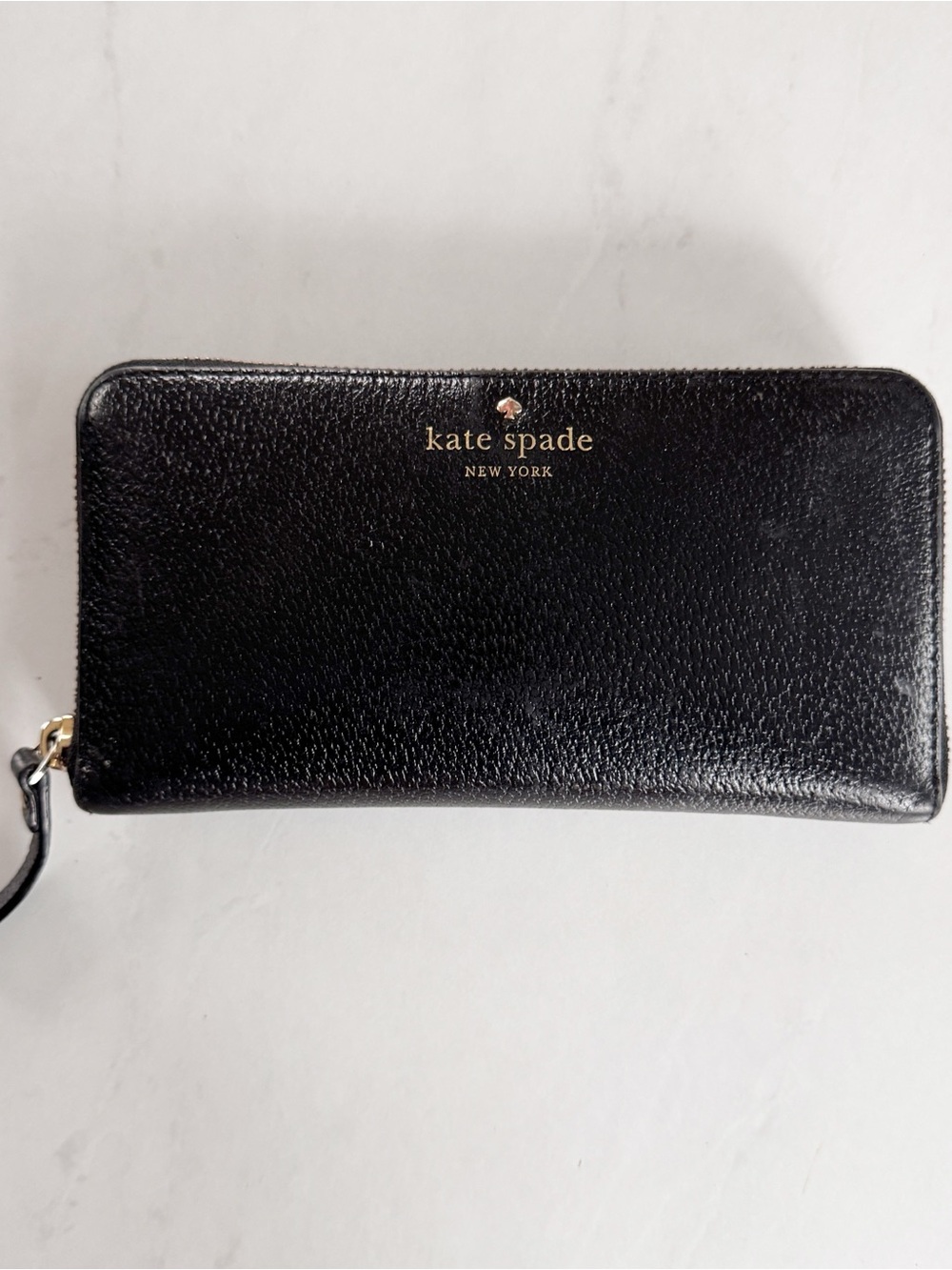 kate spade black leather zip-around wallet with gold logo